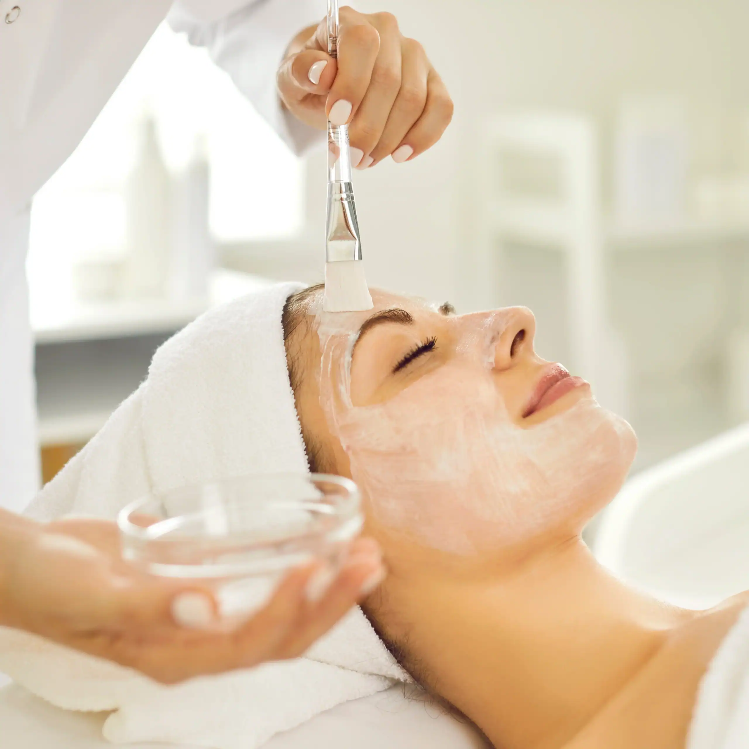 Woman getting a professional facial service