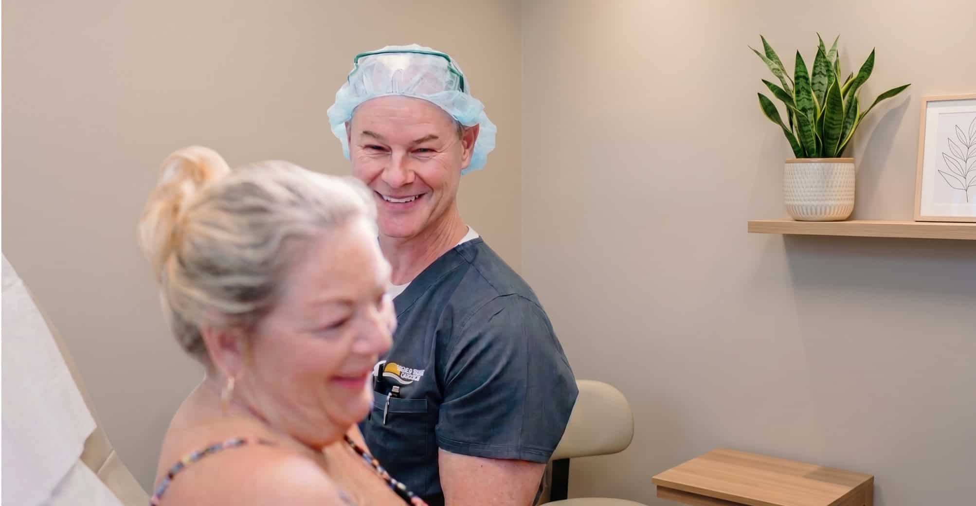 Dr. Freeman with a female patient at Sunrise Dermatology