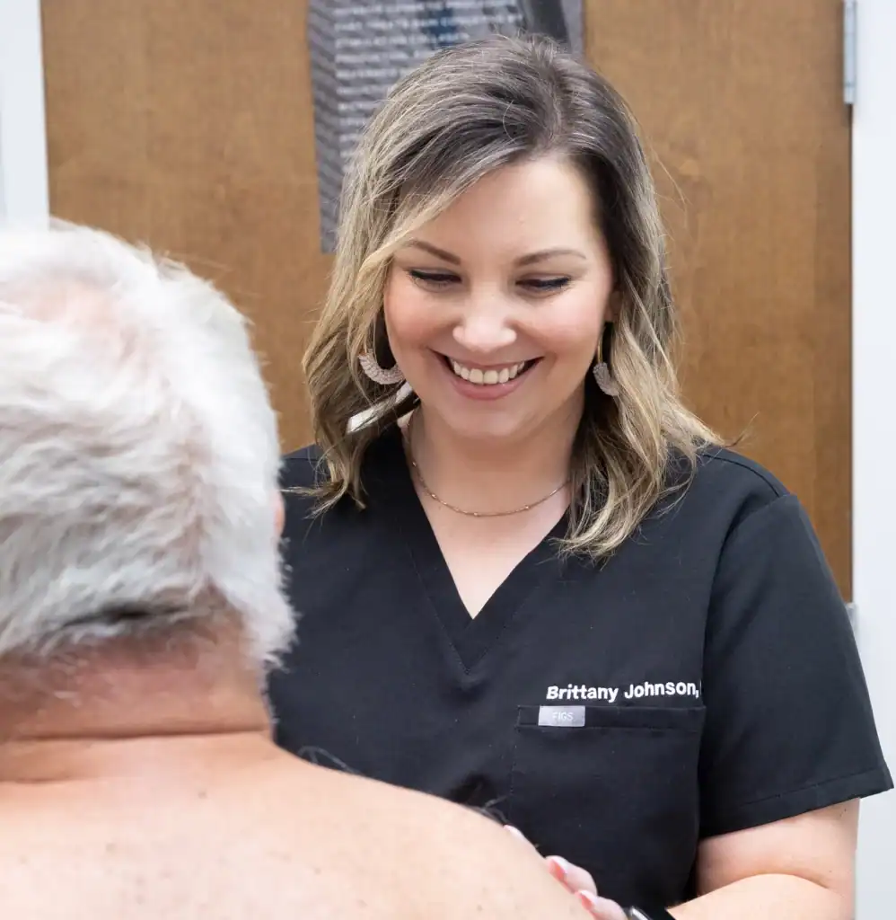 Brittany Johnson, CRNP, works with a patient at Sunrise Dermatology in Alabama